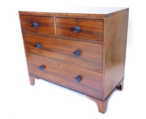 A 19thC mahogany and ebonised chest of drawers, with a plain caddy top above two short and two long drawers, each with turned