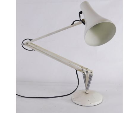 A cream painted Anglepoise lamp, on a weighted domed foot.