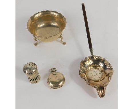 A Victorian silver bowl, by the Haseler Bros., with flared rim on hoof feet, a hollow silver pepper pot, a sieve with turned 