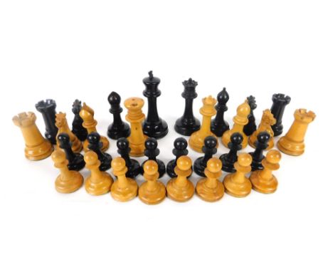 An early 20thC Staunton style chess set, with 10cm high black king, contained in a George III tea caddy with brass handle. (a