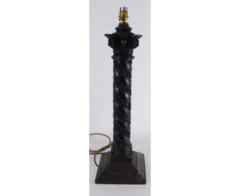 A brown wood grain effect resin column table lamp, decorated with leaves, on a square tapering base, 59cm high overall.