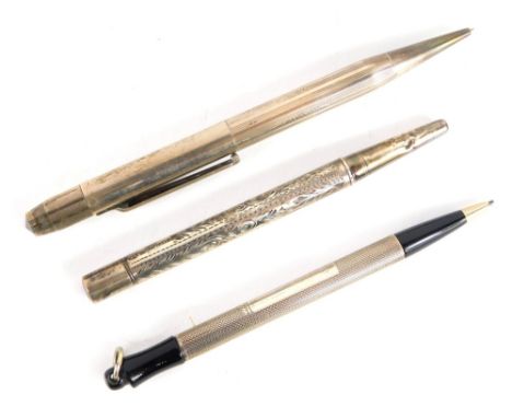 A 20thC propelling pencil, partially engine turned with black highlights, marked Stirling, 10cm long, and two various other s