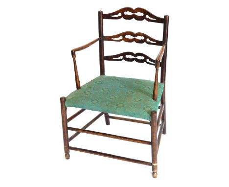 An unusual early 19thC oak country made open armchair, with a pierced ladder back, a padded seat on turned supports with stre