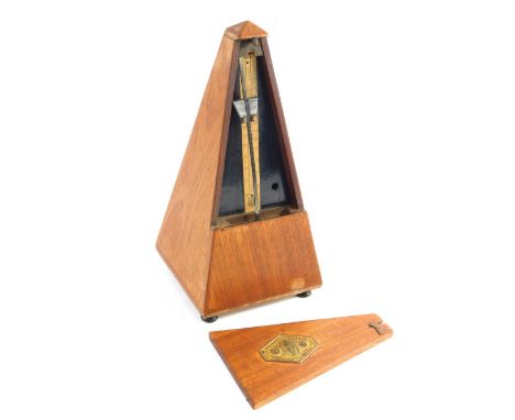 A teak cased metronome, number 485450, of triangular form with raised plaque, 24cm high.