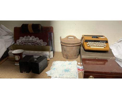 A Crochet pad together with cameras, pine pail, Petite typewriter, humidor etc