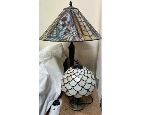 A Tiffany style table lamp decorated with flowers and leaves together with a small example