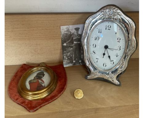 A silver framed desk clock, together with a print of a miniature and a R.C.A.F. button