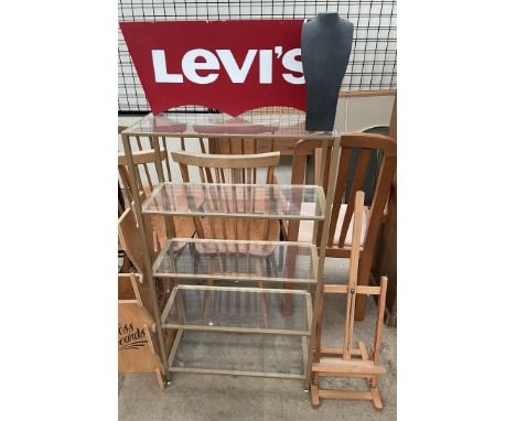 A Levi's advertising sign together with a shelf unit, an easel, mirror and a necklace stand