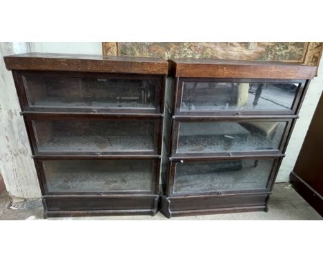 A pair of oak three section Globe-Wernicke sectional bookcases