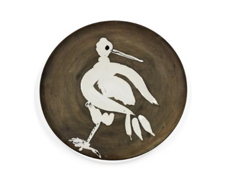 Pablo Picasso (Spanish, 1881-1973)Bird No. 82 (Ramie  482) Glazed white ceramic plate, painted in black, with black and brown
