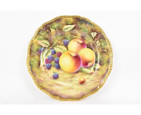 A Royal Worcester fruit decorated cabinet plate, of shaped circular form, hand painted with still lives of fruit and signed B