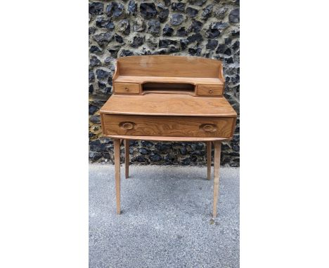 An Ercol Lucian Ercolani, Windsor range, Model 479 retro vintage 1960s blonde beech and elm desk, having a raised back galler