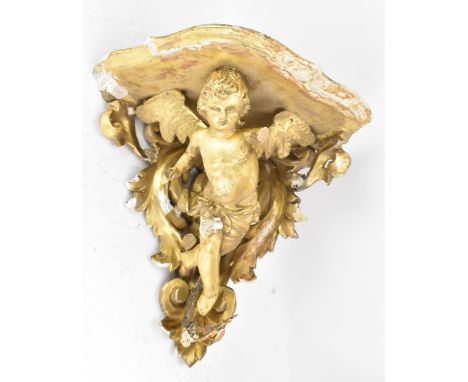 A 19th century gilt gesso corner wall hanging bracket, in the form of a winged cherub among a floral scroll design, 35cm high