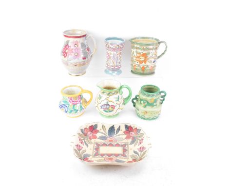 A collection of Art Deco design Charlotte Rhead pottery items to include four Crown Ducal jugs, a Crown Ducal twin handled bo