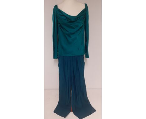 Yves Saint Laurent, French designer- A Saint Laurent Rive Gauche green/teal silk blouse having zipped cuffs with 5 buttons, E