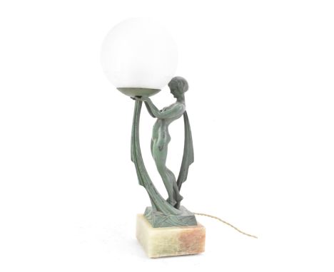 After Limousin, a French Art Deco patinated spelter figural table lamp, in the form of a naked scarf dancer uplifting the glo