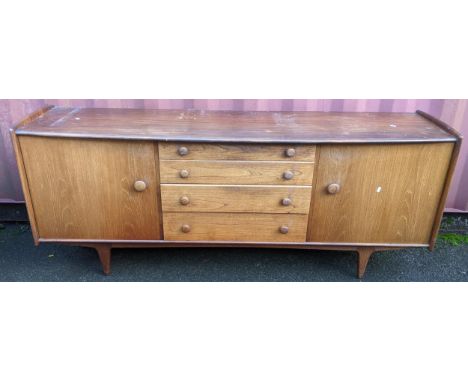 John Herbert for A. Younger Ltd - A 1960s teak Volany sideboard, having a slightly curved top over four graduated central dra