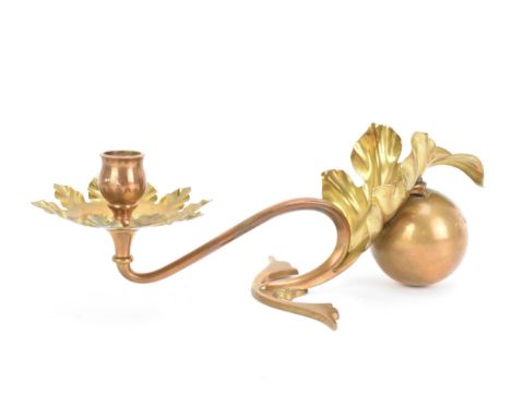 An Arts & Crafts single arm copper and brass counterbalanced candlestick, attributed to W.A.S. Benson, of naturalistic stylis