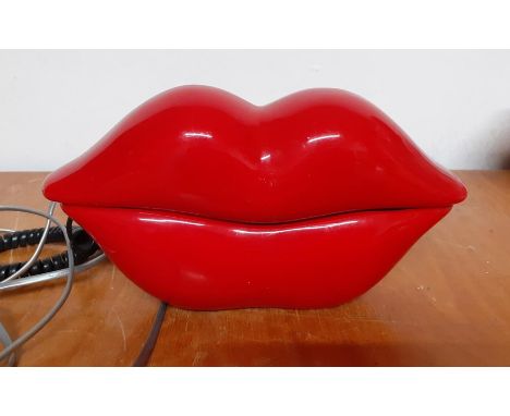 A vintage telephone red lips shaped, (22x11 cm).