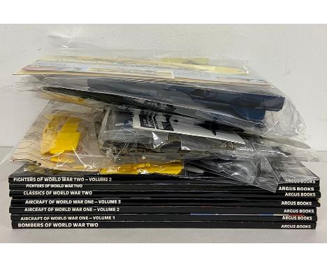 A selection of six model aircraft kits, Cessna, Tiger Shark, etc and seven books of Aircraft Archive 