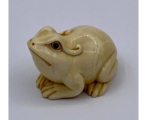A carved and signed Frog Netsuke