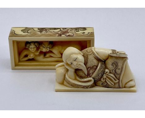 A carved and decorated erotic Japanese netsuke