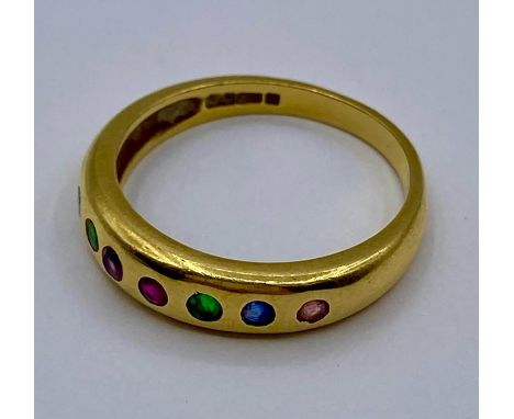 An 18ct gold seven stone ring (Total weight 3.5g) Size K 1/2
