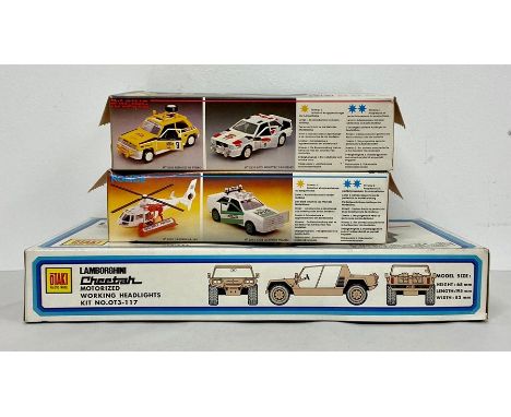 Three boxed vechile model kits, Kawasaki 1300 Police, Kawasaki 1300 Racing and Lamborghini Cheetah 