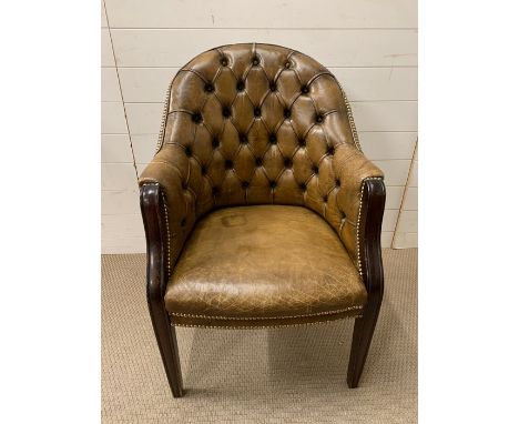 A button back leather club chair 