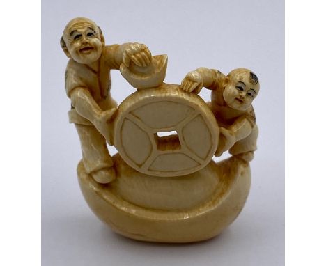 A signed netsuke in ivory 