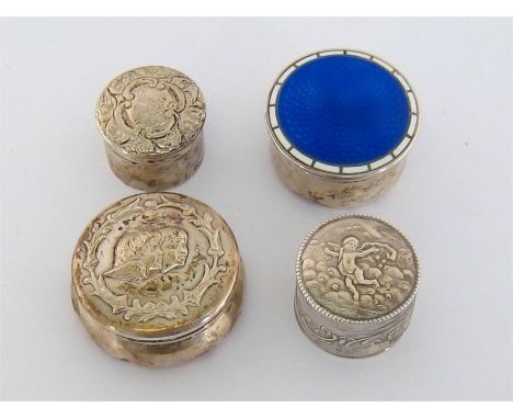 Four circular pill boxes with gilt interiors, principally late Victorian/Edwardian, comprising:- one with embossed cherubs’ h