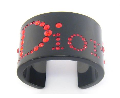 A Dior black resin and red paste cuff bangle, 6.3mm inner diameter
