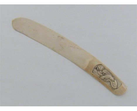 An ivory paper knife with curved blade, the grip carved with the lion of St. Mark in high relief. Length 30cm. Condition repo