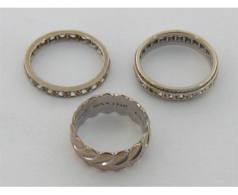 A 9 carat white gold and white stone eternity ring, fully hallmarked (one stone missing), finger size O, 3.4gms, together wit