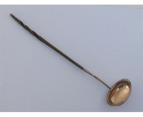 A George III silver punch ladle by Thomas Morley, London, 1793, with twisted whalebone handle, 35.7 cm. long
Condition report