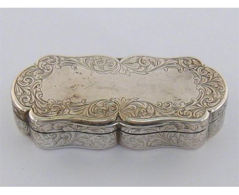 A Victorian silver snuff box by Nathaniel Mills, Birmingham, 1845, rectangular with shaped outline and foliate scrolling, the