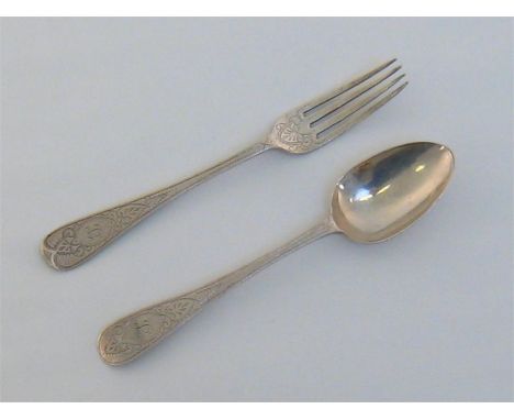 A Victorian silver christening spoon and fork by Messrs. Barnard, London, 1868, engraved with oval medallions and anthemions 