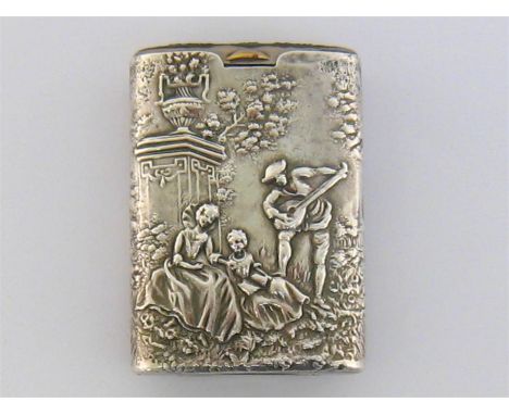 A German vesta case, early 20th century, the silver outer sleeve chased on either side with a lute player serenading two 18th