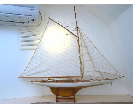A large model gaff rigged yacht with mainsail and two jibs, all sewn linen. Fully rigged, complete with hatches, cabin skylig