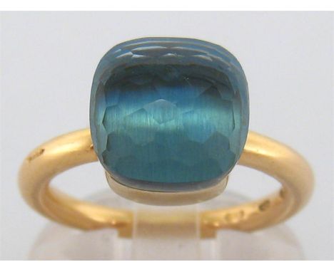 Pomellato, ‘Nudo’, an Italian 18 carat gold and topaz ring, the cushion shaped faceted stone 10.5 x 10.5mm, the rounded shank