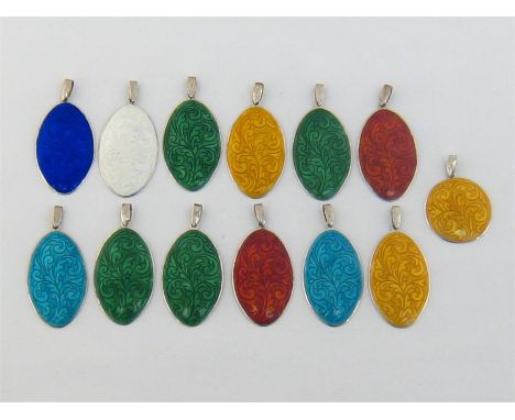 A mixed lot of silver (sterling 925) and guilloche enamel pendants, each convex oval disc with arabesque patterns beneath one