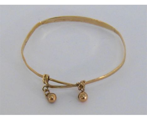 A gold (tests 14 carat) bangle, with cross over sliding clasp, 4.9gms

Condition reportmishapen