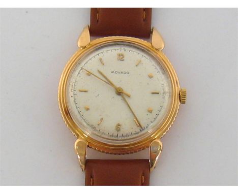 MOVADO, a gentleman’s 18 carat gold manual wind dress watch, ref. R86982 no. 278982, the silvered dial with applied gold mark