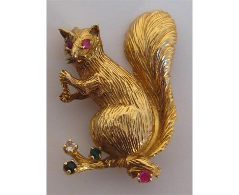 A 1960s 9 carat gold and gem set brooch, import marked London 1966, modelled as a squirrel and accented with ruby, emerald, s