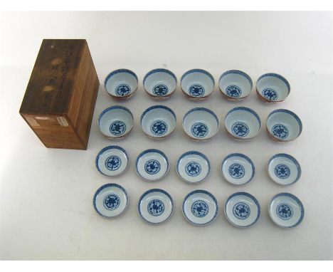 A set of ten Japanese tea bowls and saucers in unused condition in original fabric packing and hardwood case, the lid with ch