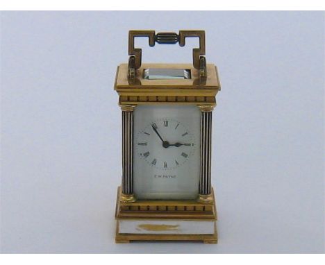 A gilt brass miniature carriage clock with English movement, needs attention,  and white enamelled face with black Roman nume