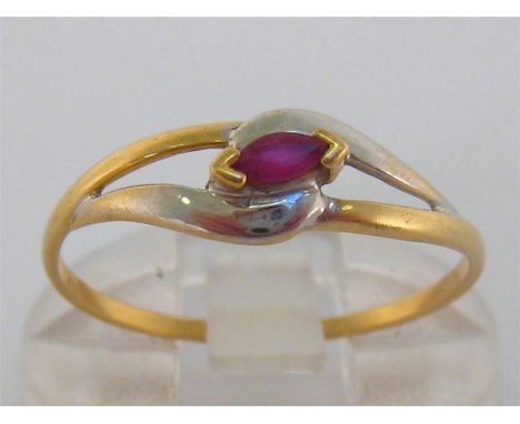 A French 18 carat gold and ruby ring, set with a small marquise cut ruby, in a two colour gold openwork mount, French poincon