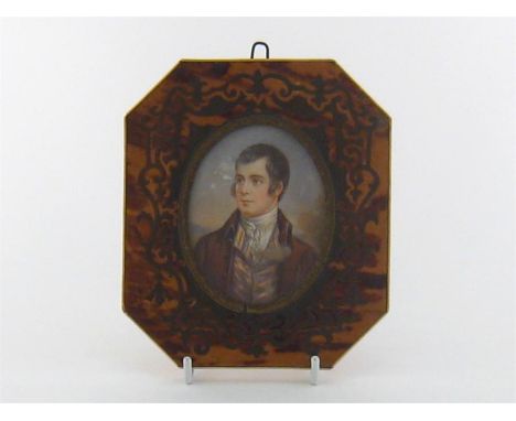 An oval watercolour portrait of Robert Burns in octagonal tortoiseshell faced frame inlaid in the Boulle manner but apparentl
