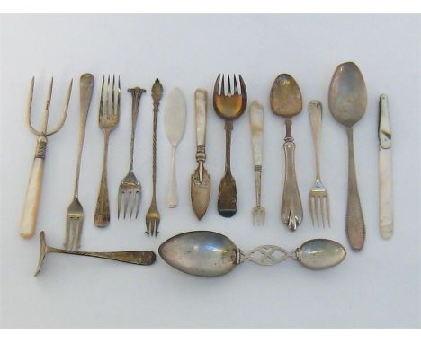 A miscellaneous group of silver items, mostly English, comprising:-  2 butter knives including one with MOP handle; 3 pickle 