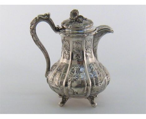 A Canadian silver Chinoiserie covered milk jug by J. G. Joseph & Co. of Toronto, circa 1870, fluted baluster form chased with
